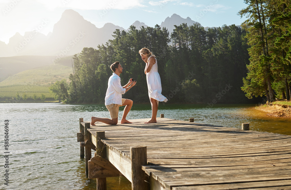 proposal on a dock with mountains behind